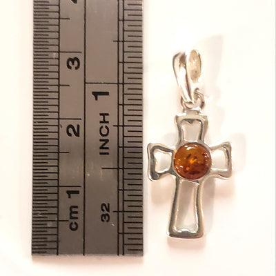 small amber silver cross