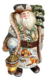 Wooden Santa in a fur coat with a lantern, hand painted snowy landscape.