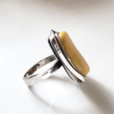 side of the antique frame butterscotch natural amber silver ring