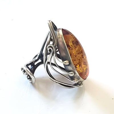 adjustable sterling silver ring with large oval amber 