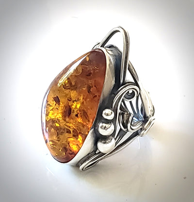 Handmade sterling silver unique ring with large natural oval amber