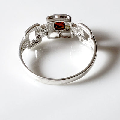 the back side of sterling silver ring with amber