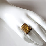 Green amber unisex muscular amber ring in sterling silver  on hand display