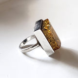 side of the Green amber unisex muscular amber ring in sterling silver 