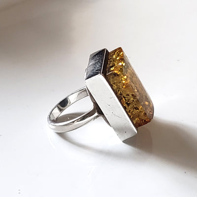 side of the Green amber unisex muscular amber ring in sterling silver 