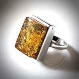 Unisex natural amber ring in sterling silver frame