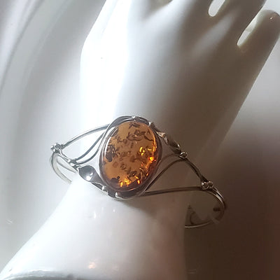  cuff silver bracelet with honey amber on hand