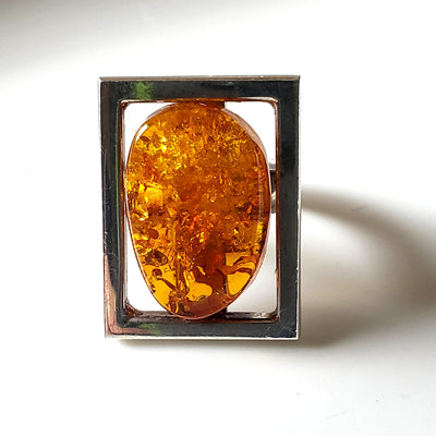 Unisex ring, large rectangle sterling silver frame with free form natural honey amber inside the frame 