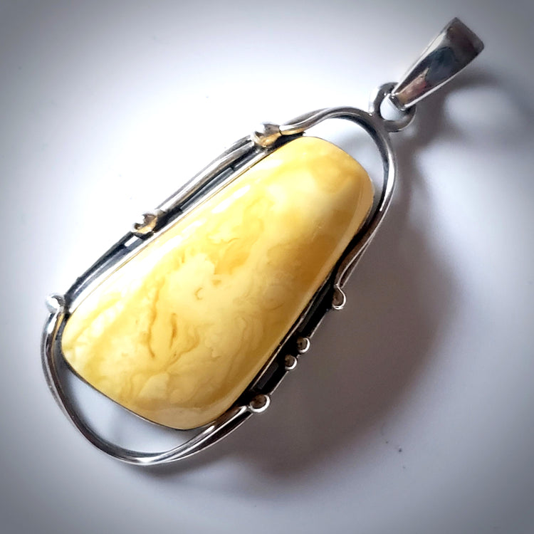 one of the king butterscotch oval amber pendant