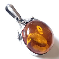 Classic Round Natural amber pendant in sterling silver frame