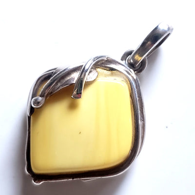 genuine light yellow  butterscotch amber pendant in sterling silver frame