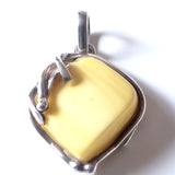 genuine light yellow  butterscotch amber pendant in sterling silver frame