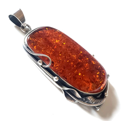 Large amber pendant in sterling silver handcrafted frame