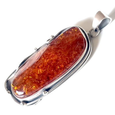 Large amber pendant in sterling silver