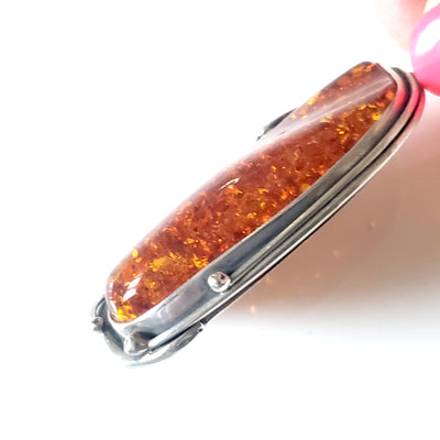 Large amber pendant in sterling silver