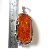 Large amber pendant in sterling silver