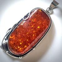 Large amber pendant in sterling silver
