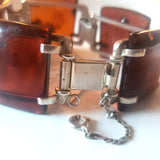 Sterling silver locker with security chain  on large amber bracelet