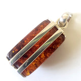 Rectangular cognac amber pendant in sterling silver frame back