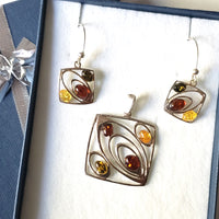 modern amber pendant and earrings set in sterling silver