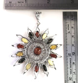 large sun pendant with multicolor amber