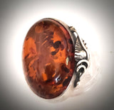 large oval natural amber ring in silver