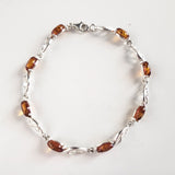 sterling silver butterfly link bracelet with amber beads