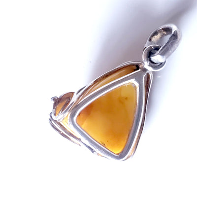 back of Classic small butterscotch amber pendant in sterling silver frame