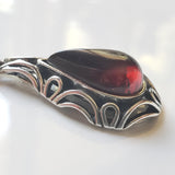 Cherry red amber pendant wth silver