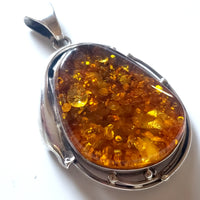 Large green amber in sterling silver pendant