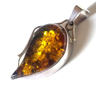 Large golden-green natural amber pendant in sterling silver