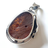 back of Large green amber in sterling silver pendant