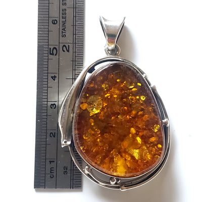 size of Large green amber in sterling silver pendant