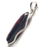 red cherry amber pendant in modern silver