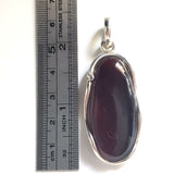 long cherry red natural amber pendant in silver