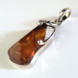 amber in silver pendant
