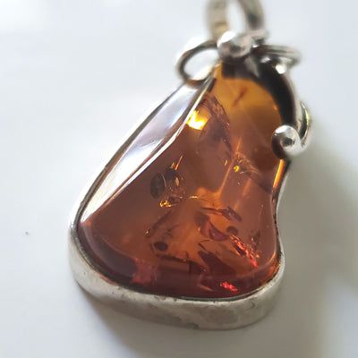 natural amber in silver pendant