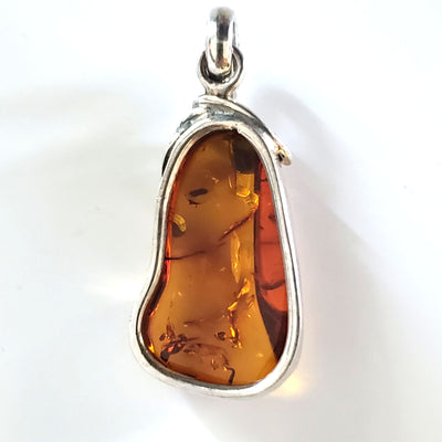 classic amber pendant in silver setting