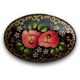 oval handcrafted brooch with pink flowers