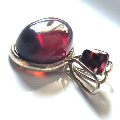 red amber oval pendant in sterling silver