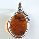 natural amber in silver pendant