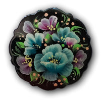 blue flowers painted on black pin