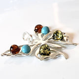 silver butterfly with amber and turquoise beads