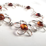 silver flower with amber link bracelet