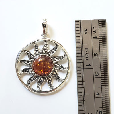 round amber sun pendant